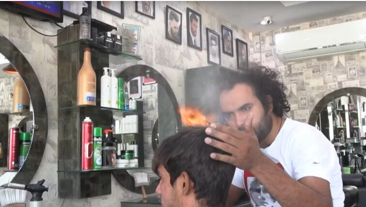 Pakistani barber offers hair-raising cuts with cleavers, blowtorches